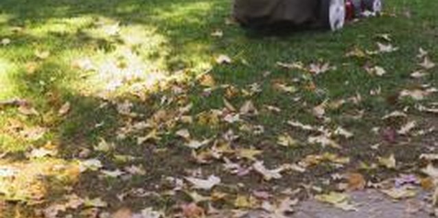 Brand X Pictures/Brand X Pictures/Getty Images Lawnmower bag repair takes little time at a nominal cost.