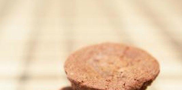 Jupiterimages/Photos.com/Getty Images Old baking soda will make your cupcakes flat and dense.