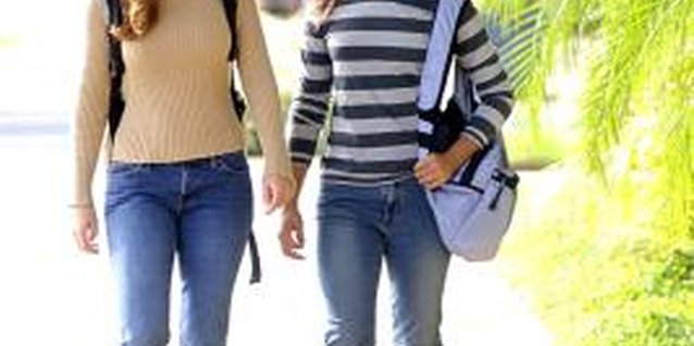 Thinkstock Images/Comstock/Getty Images Your daughter can boost her fitness level by walking to school.
