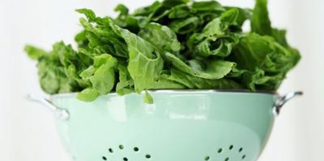 Stockbyte/Stockbyte/Getty Images Spinach can cook in just minutes on the stove.