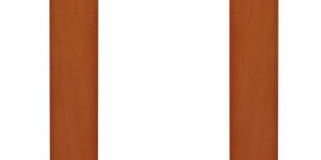 Stockbyte/Stockbyte/Getty Images Add fabric or wallpaper to your frame to complement your room decor.