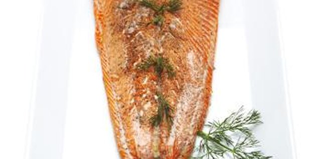 Thomas Northcut/Digital Vision/Getty Images Tailoring the seasoning to his tastes can encourage your tot to try salmon.