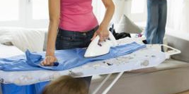 BananaStock/BananaStock/Getty Images Cotton clothing often needs ironing, while microfiber clothing usually doesn't.