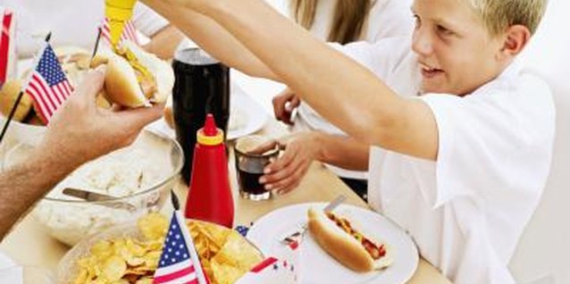 Stockbyte/Stockbyte/Getty Images Yellow mustard is generally associated with hot dogs and used as a table condiment.
