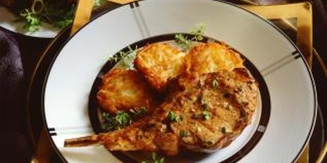 Jupiterimages/Comstock/Getty Images Some recipes call for cooking the chop in its marinade.
