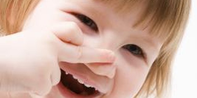 BananaStock/BananaStock/Getty Images You can use books to teach kids about their noses and the sense of smell.