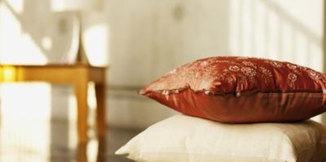 George Doyle/Stockbyte/Getty Images Sprawling on the floor is more comfortable with comforter-based cushions.