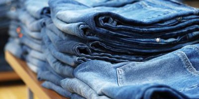 Ciaran Griffin/Stockbyte/Getty Images Shop for jeans that fit regular or low on the hip while not hanging too loosely.