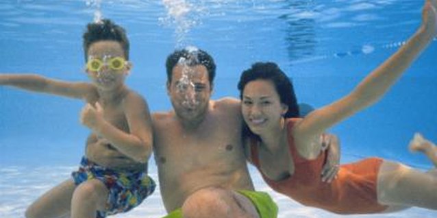 Stockbyte/Stockbyte/Getty Images Regular superchlorination keeps your pool water safe for your family.