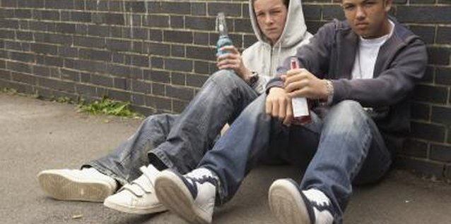 BananaStock/BananaStock/Getty Images Drinking alcohol creates serious risks for rebellious teens.