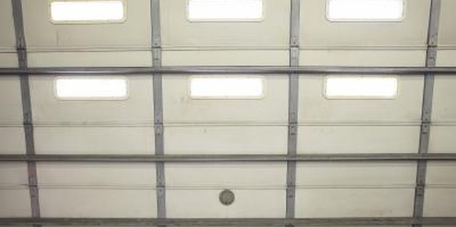 Jupiterimages/Photos.com/Getty Images An uninsulated garage door can be an energy leaker.