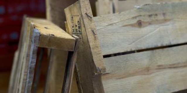 Jupiterimages/Photos.com/Getty Images A wooden pallet creates the basic framework for a vertical herb garden.