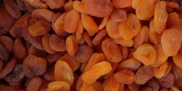 Hemera Technologies/AbleStock.com/Getty Images Dried apricots are too large and tough for young children to chew.