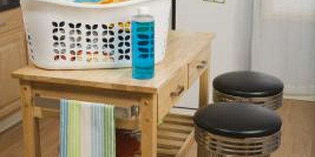 Jupiterimages/Creatas/Getty Images Reupholstering a basic stool requires no sewing or stitching.
