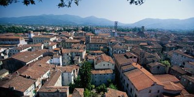 Brand X Pictures/Brand X Pictures/Getty Images Tuscan red-tiled roofs, like these in Lucca, are emblematic of the style named for this region.