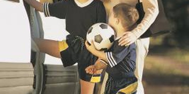 Comstock/Comstock/Getty Images Show love for your child whether he wins or loses the game.