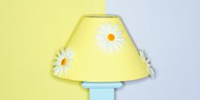 Jupiterimages/Photos.com/Getty Images Bright-colored paint and decorative appliques add zing to a lackluster lampshade.