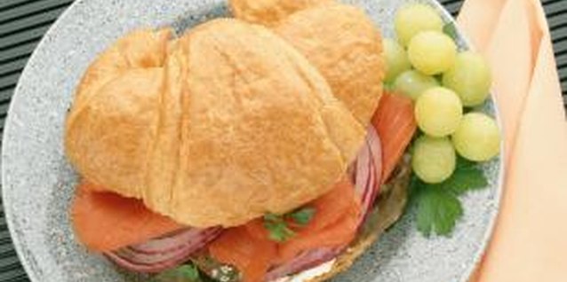 Jupiterimages/Photos.com/Getty Images Use a light, buttery croissant for a tasty salmon sandwich.