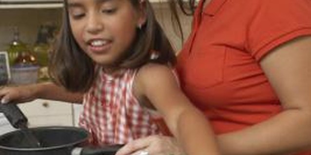 Jack Hollingsworth/Photodisc/Getty Images Work together with your daughter to promote a healthy lifestyle.