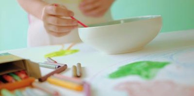 Jupiterimages/liquidlibrary/Getty Images Mix and match different colros and stamps for your child's own artistic adventure.