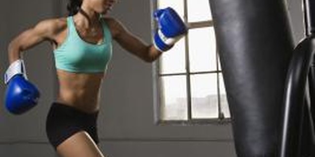 Jupiterimages/Brand X Pictures/Getty Images Women can regularly train using a punching bag.