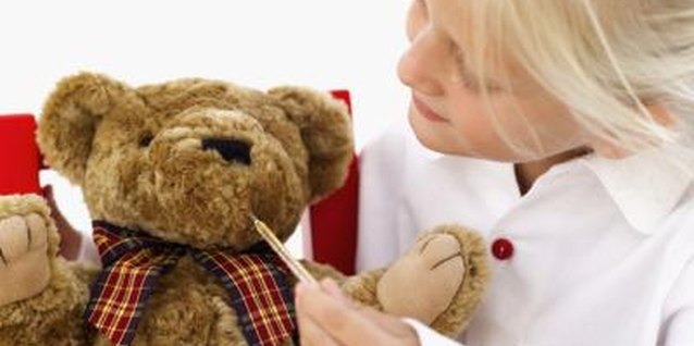 Stockbyte/Stockbyte/Getty Images Explain to your child that longer red thermometer lines mean warmer temperatures.