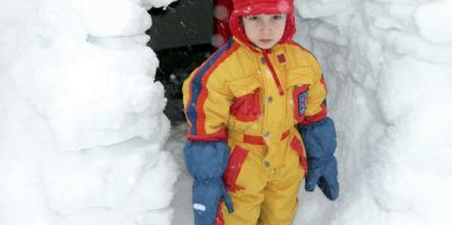 Ablestock.com/AbleStock.com/Getty Images Keep his gloves in place so he can get back to his snow fort building.
