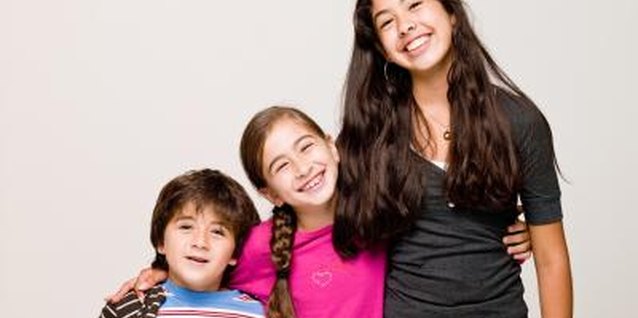 Jupiterimages/Photos.com/Getty Images Sweet sibling harmony. Fair, not equal, parenting means adjusting your approach to suit the child.