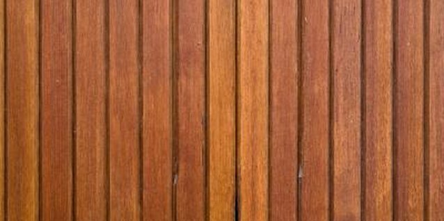 Jupiterimages/Photos.com/Getty Images Turn a boring slab of beadboard paneling into a creative bedroom focal point.