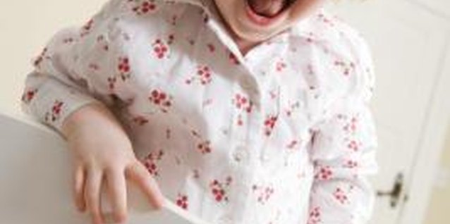 BananaStock/BananaStock/Getty Images Bed rails help toddlers transition from crib to bed.