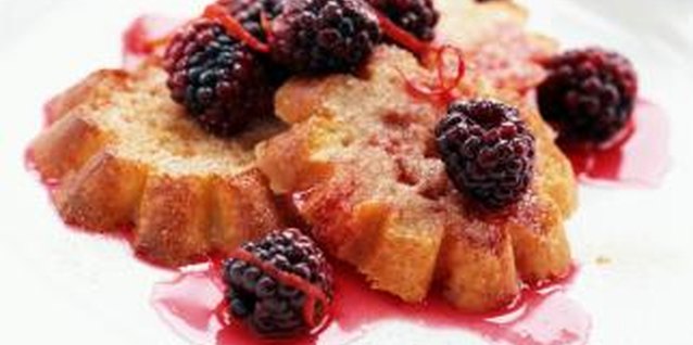 Digital Vision/Digital Vision/Getty Images A summertime treat, ripe blackberries can be eaten fresh or used in sauces, jams or jellies.
