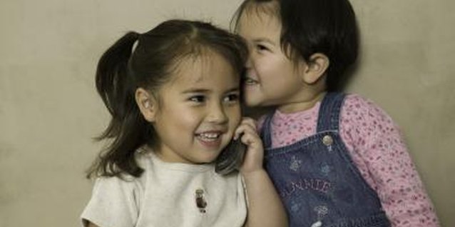 Photodisc/Photodisc/Getty Images Teach your child that idle gossip is no laughing matter.