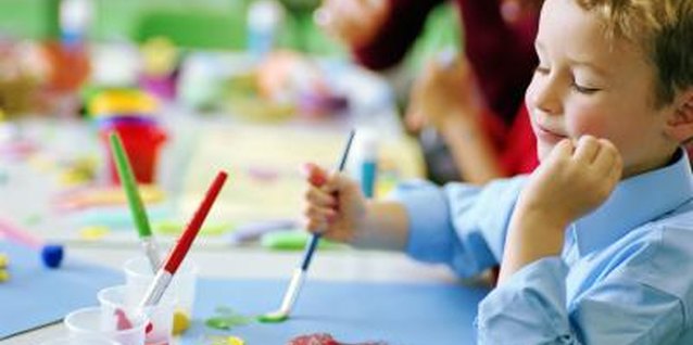 Katy McDonnell/Digital Vision/Getty Images Found objects or toys can be used as paint tools for children.