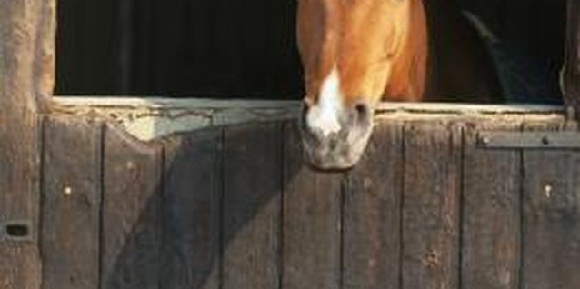 David De Lossy/Photodisc/Getty Images Horses and barns go together.