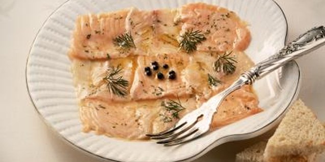 Eising/Photodisc/Getty Images Salmon cooks quickly and flakes easily with a fork when it is done.