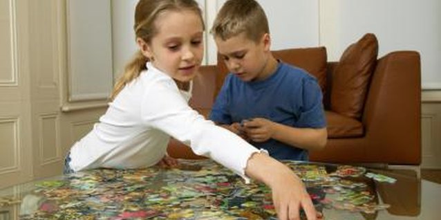 Ableimages/Digital Vision/Getty Images Puzzles promote spatial awareness and logical thinking.