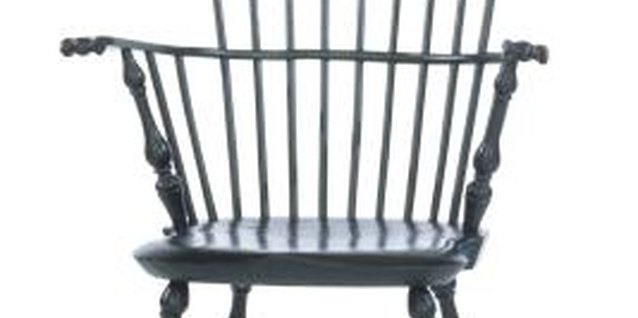 Comstock Images/Stockbyte/Getty Images Giving a Colonial chair a glossy black finish instantly updates the look.