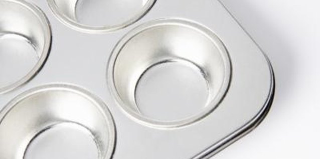 BananaStock/BananaStock/Getty Images Use common kitchen items such as muffin tins to help your preschool child practice counting.