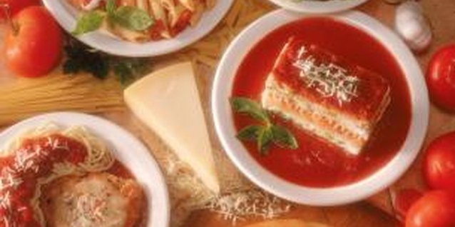 Jupiterimages/Comstock/Getty Images Pan-searing and baking breaded chicken makes for an easy chicken Parmesan.