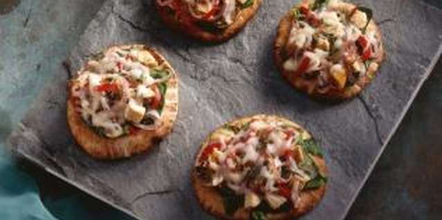 Jupiterimages/Comstock/Getty Images Use small, individual-sized flatbread for personal pizzas.