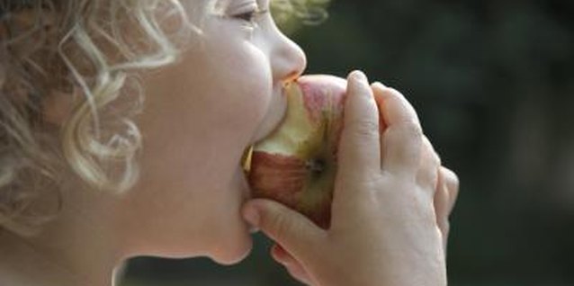 Ableimages/Photodisc/Getty Images Controlling pests without chemicals makes the apples safer to eat.