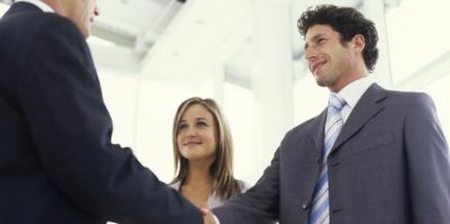 George Doyle/Stockbyte/Getty Images Mention the wife before her husband in most greeting situations.