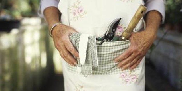 George Doyle/Stockbyte/Getty Images Keep pruners and garden gloves clean and where they're easy to find.