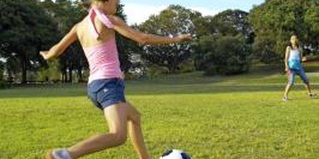 Kane Skennar/Digital Vision/Getty Images Playing ball is a good way to encourage large motor skills.
