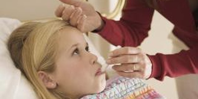 Jupiterimages/Brand X Pictures/Getty Images Being in bed can be boring, so spend some time with your child.