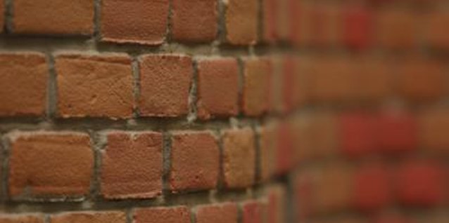 Hemera Technologies/AbleStock.com/Getty Images Adjust the bricks position to create a curve that in the wall.