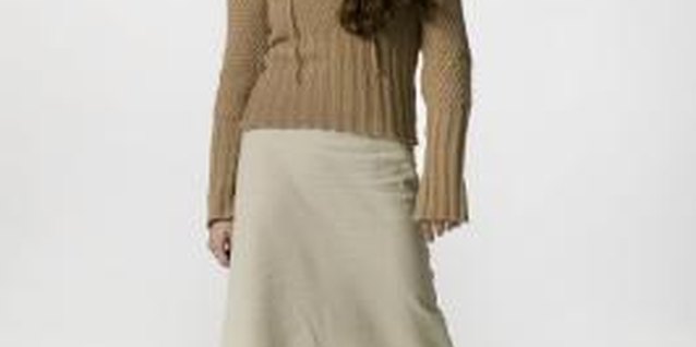 Photodisc/Photodisc/Getty Images Re-style your khaki skirt with updated outfit ideas.