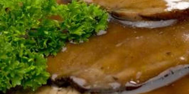 Jupiterimages/liquidlibrary/Getty Images Serve roast beef with mashed potatoes and gravy for a traditional meal.