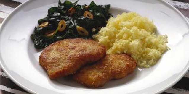 Eising/Photodisc/Getty Images Fry breaded chicken breast fillets until they are a uniform, golden color.