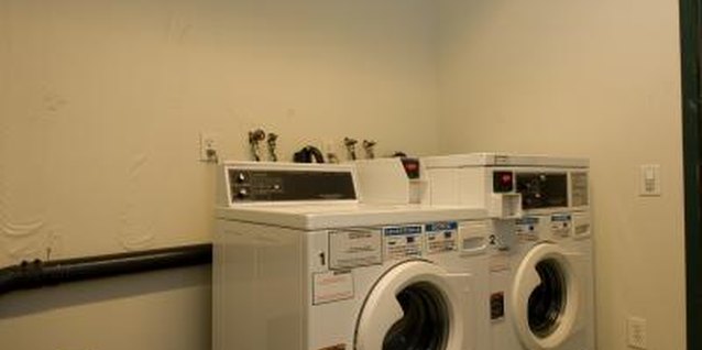 Jupiterimages/Photos.com/Getty Images A cheery paint color makes a laundry room feel more inviting.